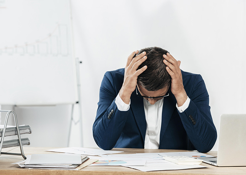 depressed man to represent the effect of bankruptcy on estate planning
